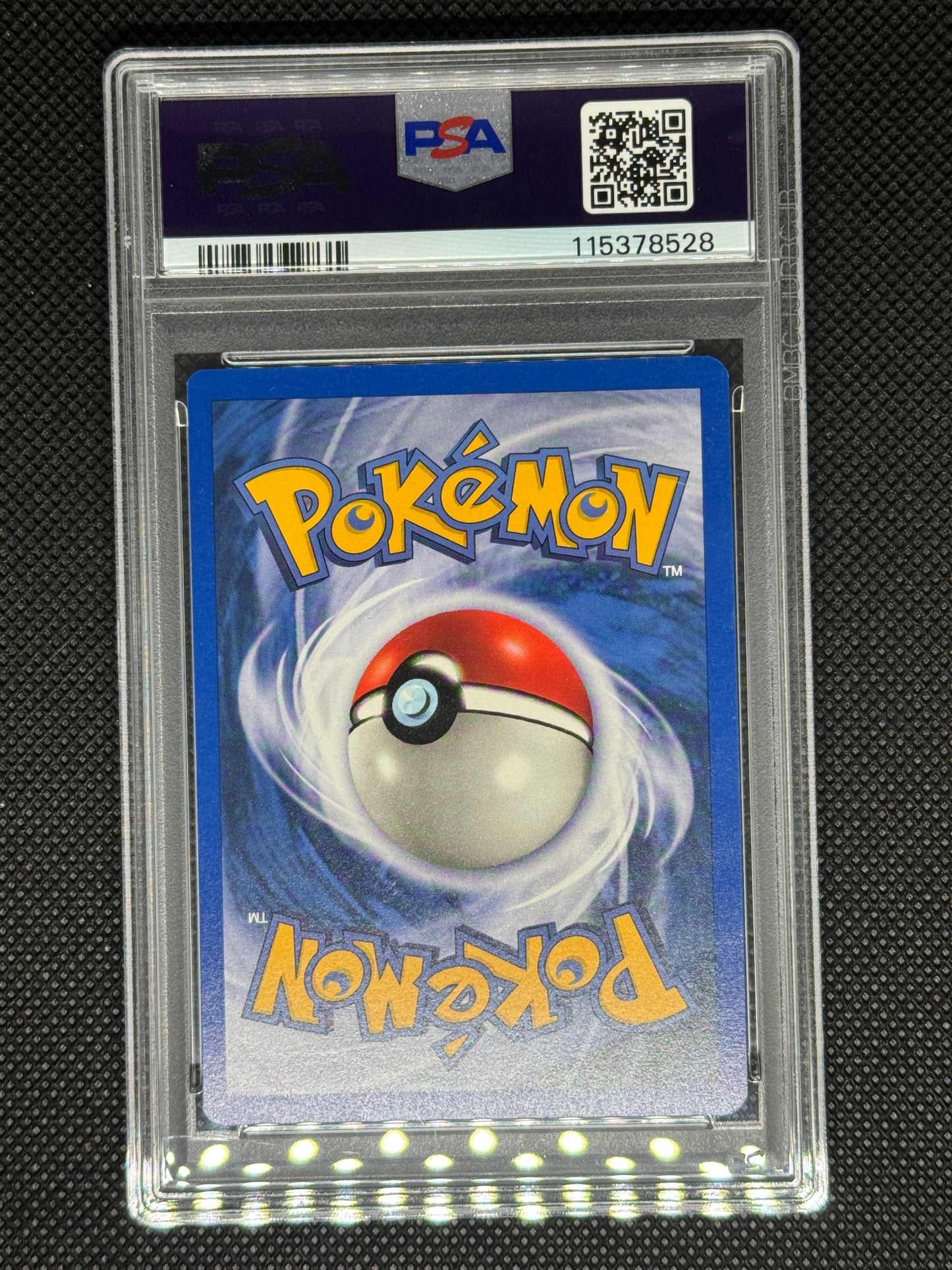 Pokémon trading card in a PSA protective case with its ID number and barcode and QR code.