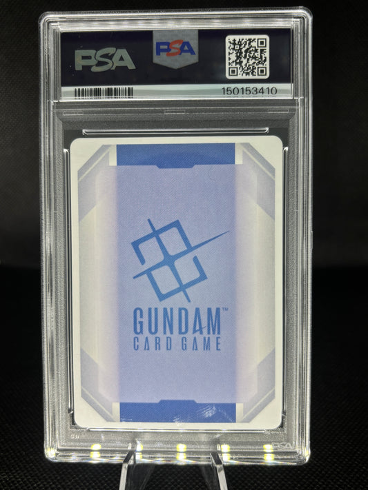 A PSA graded Gundam Card Game card sealed in a clear PSA slab, displayed on a stand against a dark background. The card features a light blue and white geometric design with the blue Gundam logo and text.