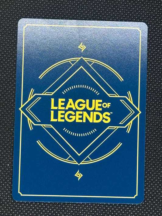 League of Legends card with blue background and yellow text on a textured black surface