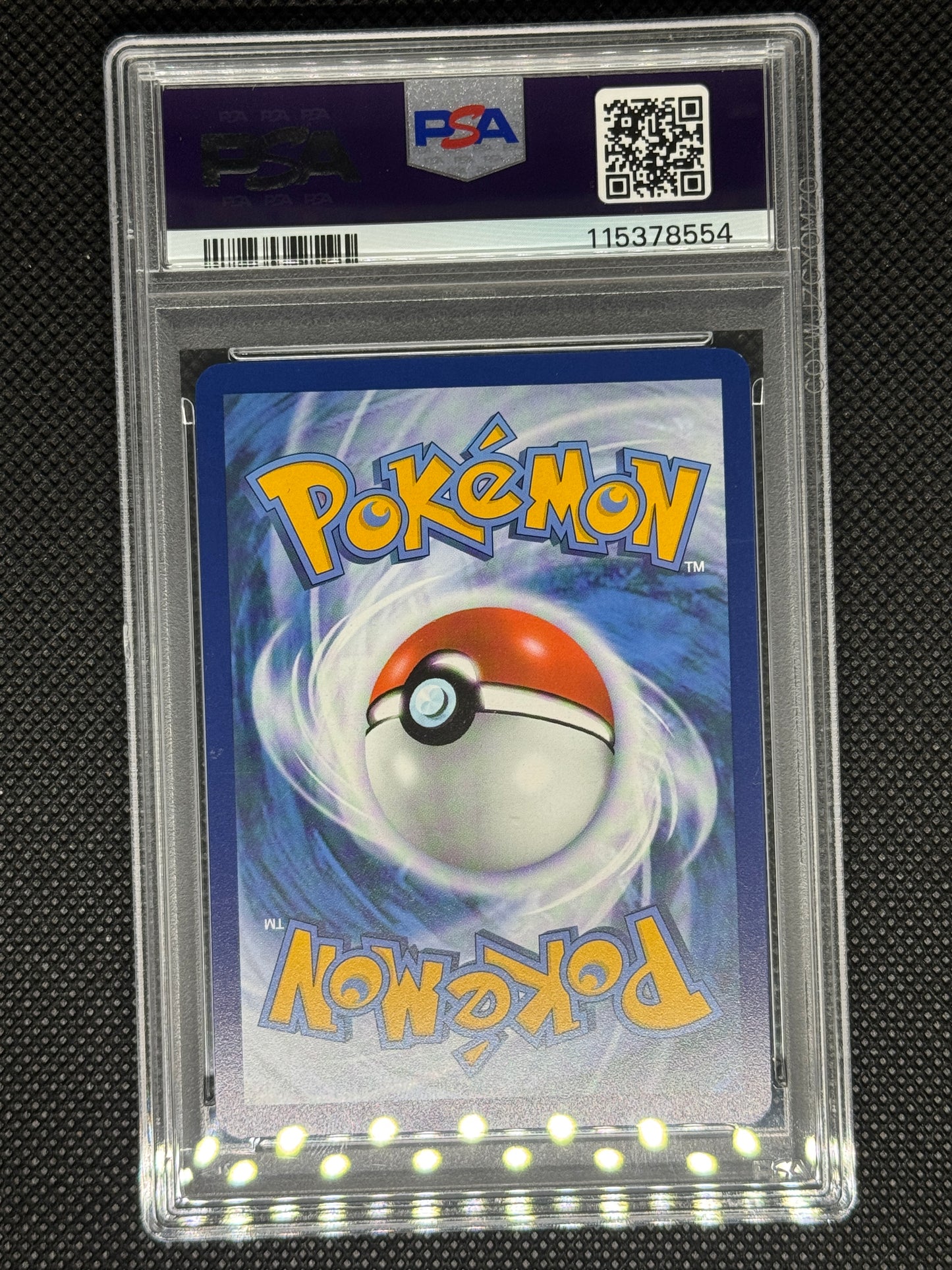 Pokémon trading card in a protective case with a visible PSA logo, barcode, QR code, and ID number.
