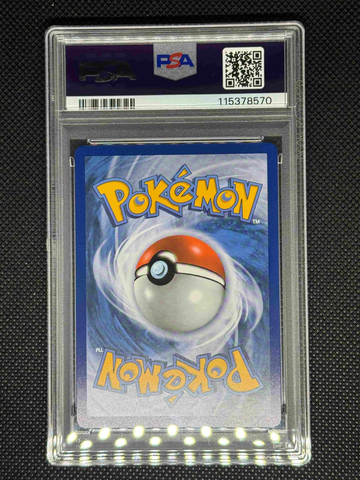 Pokémon trading card in a protective case with a visible PSA logo, barcode, QR code, and ID number.