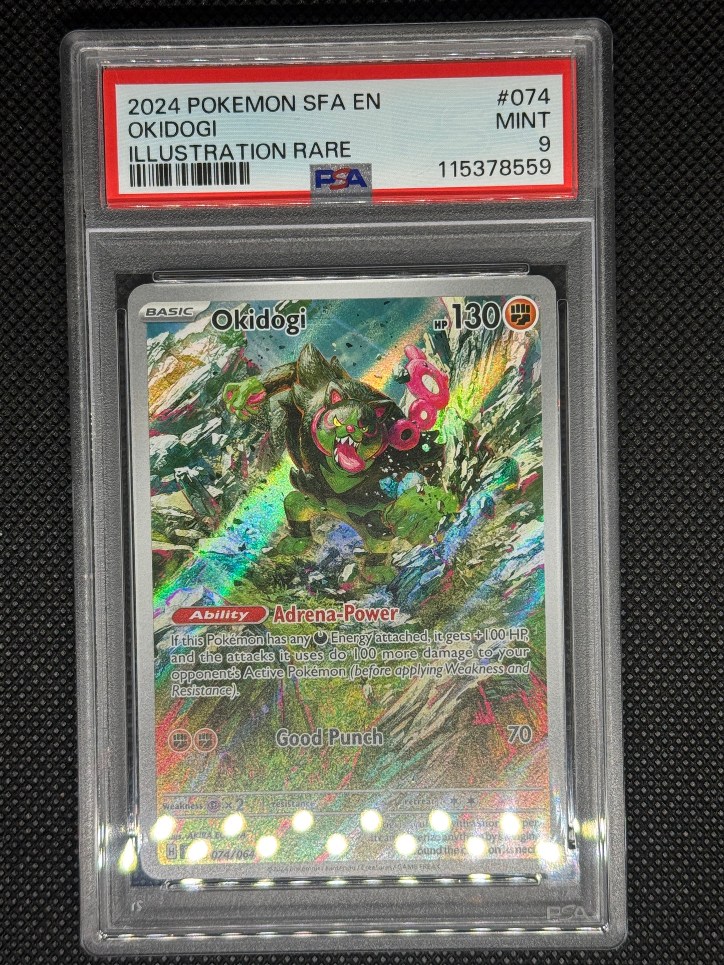 Okidogi illustration rare in a PSA 9 slab with the set, card number, ID, and barcode.