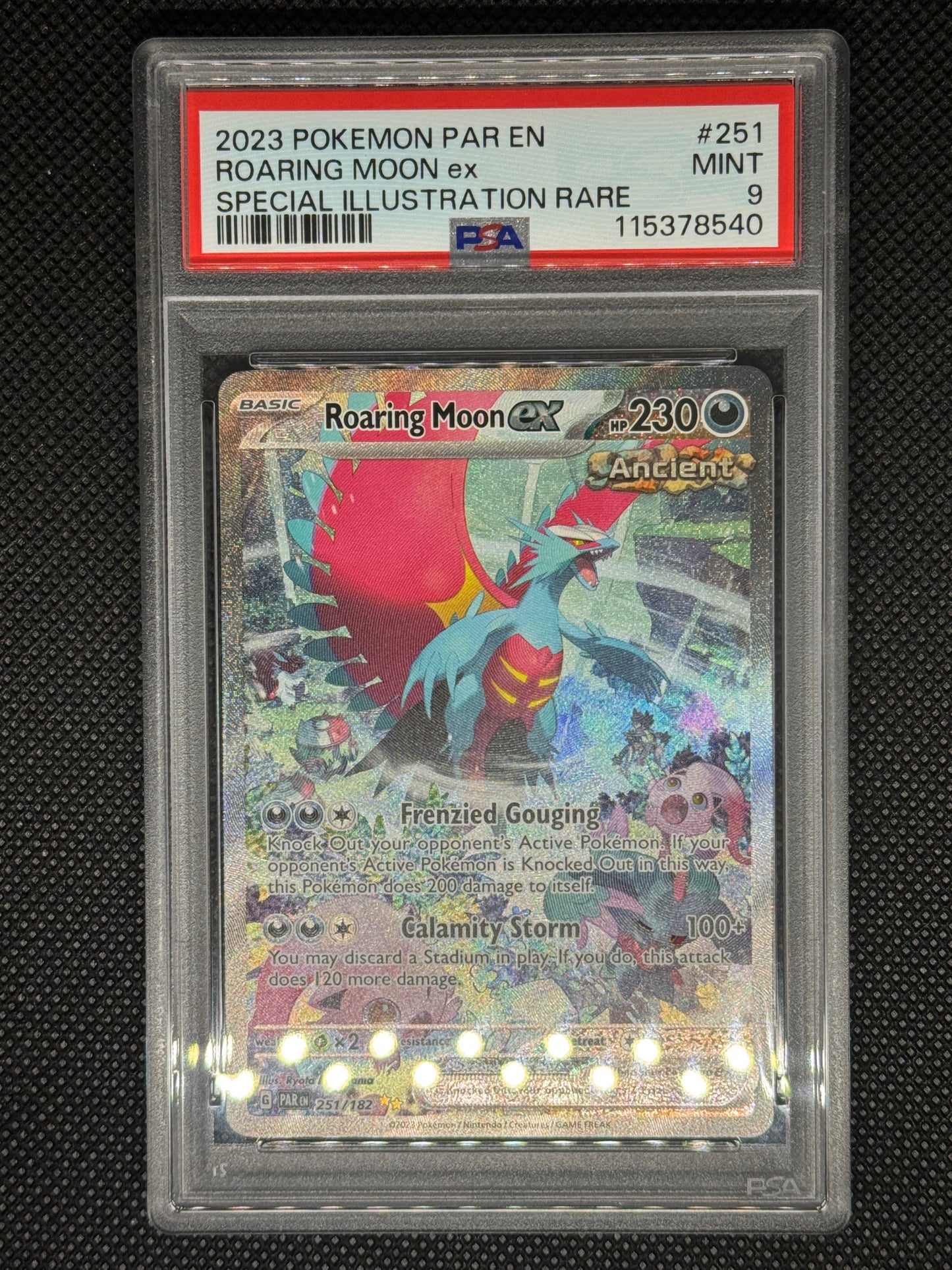 roaringmoonex SIR in a psa9 from paldean fates with ID number, barcode, card number.