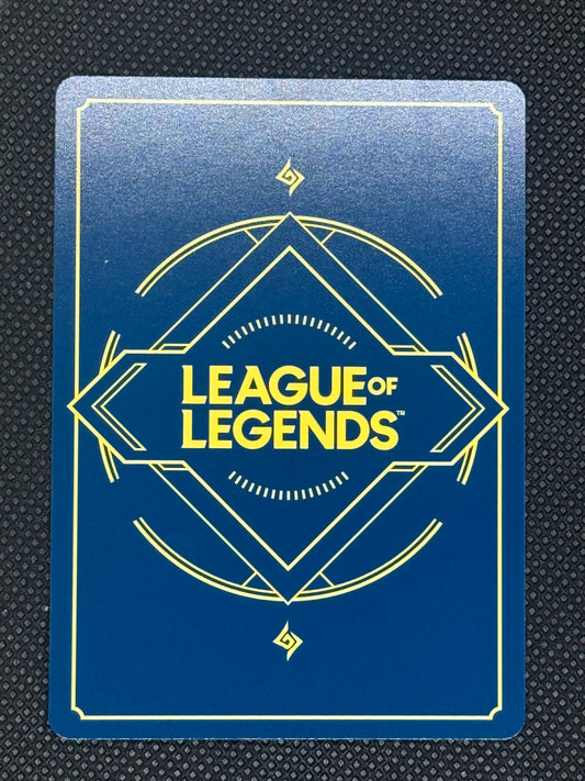 League of Legends card with blue background and yellow text on a textured black surface