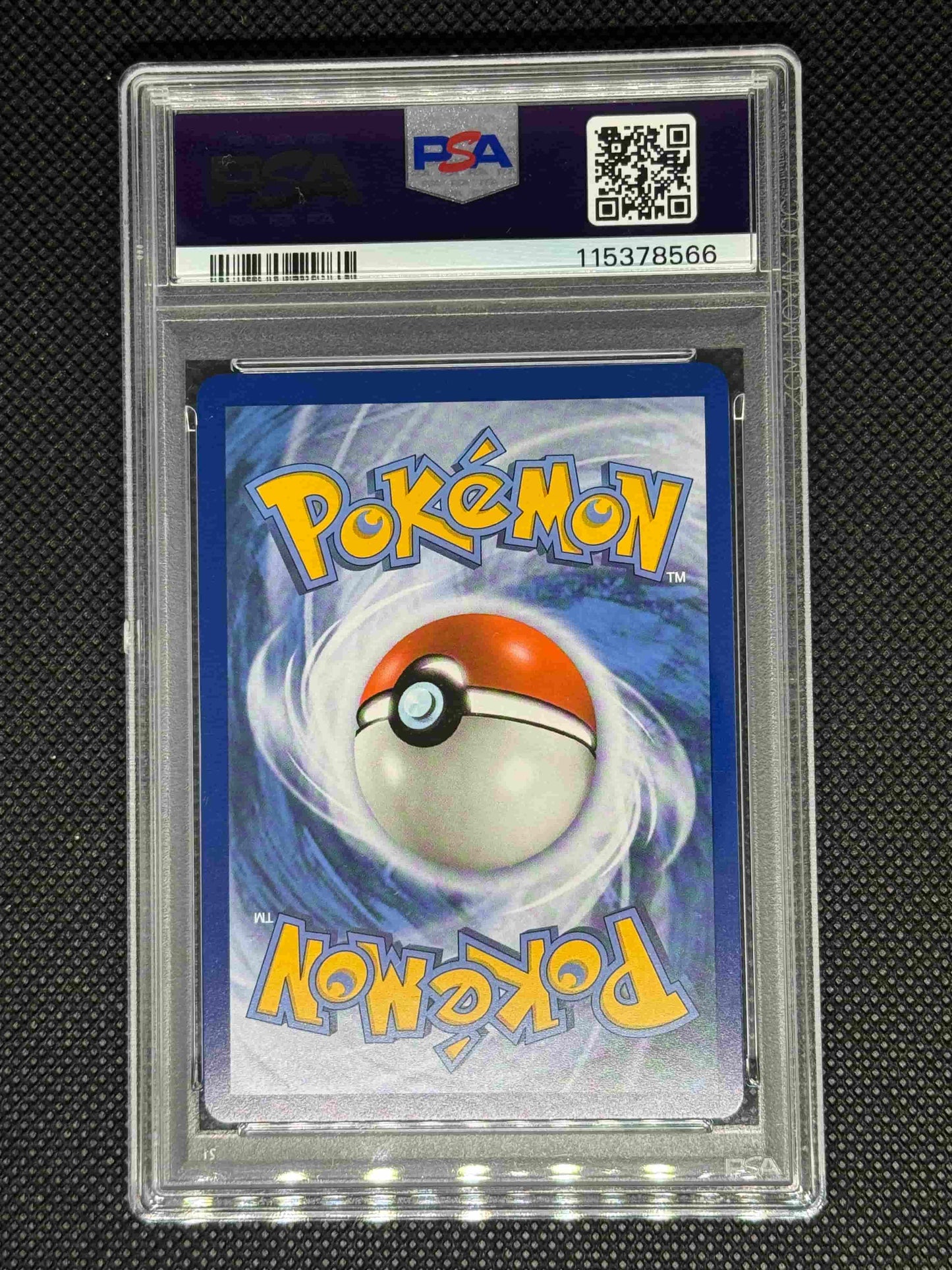 Pokémon trading card in a protective case with PSA, QR code, barcode, and ID.