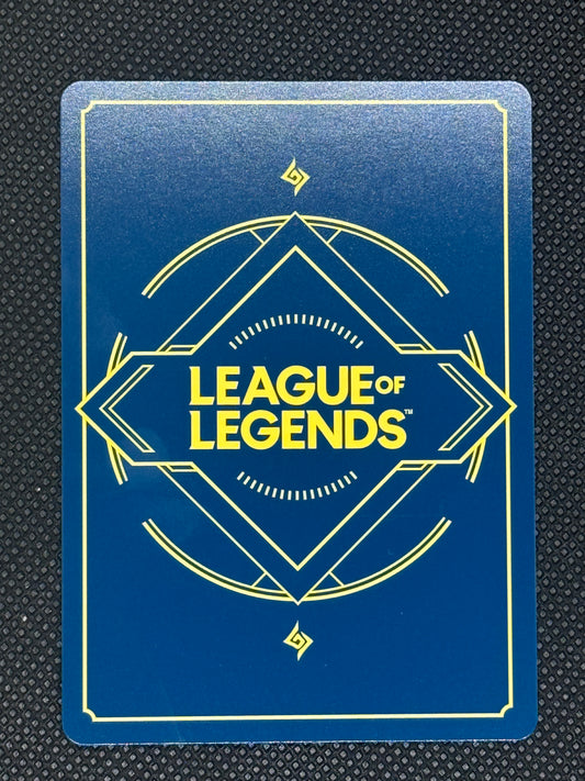 League of Legends card with blue background and yellow text on a textured black surface