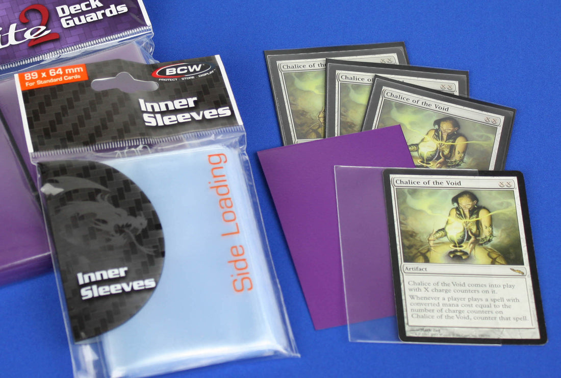 Trading cards with a perfect sleeve plus a playing card protector sleeve.