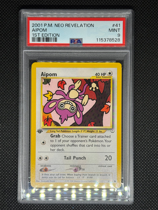 Aipom in a protective case with PSA grading label 9 with its ID number, card number, set, and barcode.