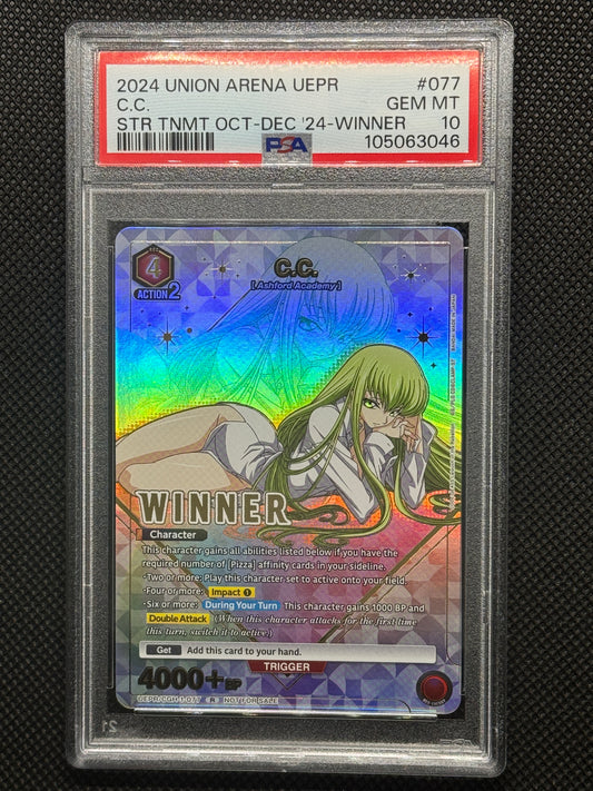 C.C. laying down looking straight at you with a silver background and winner text stamped on the card.