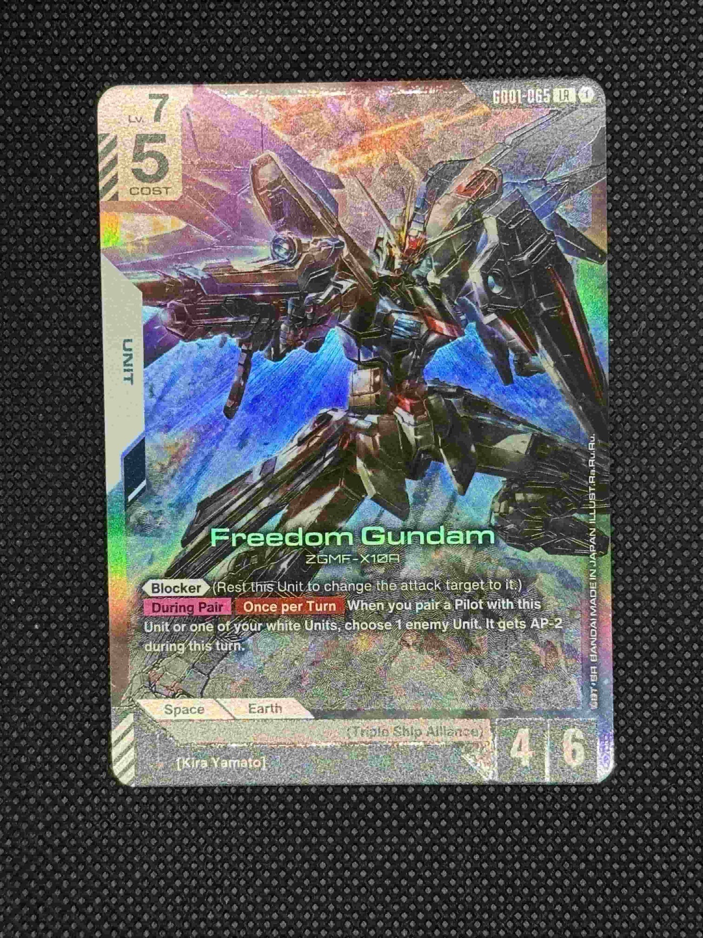 Card with Freedom Gundam posing with his Beam rifle