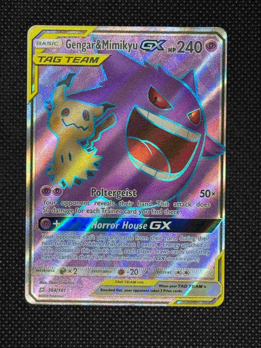 Mimikyu and Gengar posing together