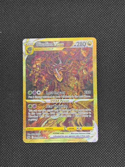 Giratina slithering down a tree with a lot of things hanging from the tree and a gold border and background.