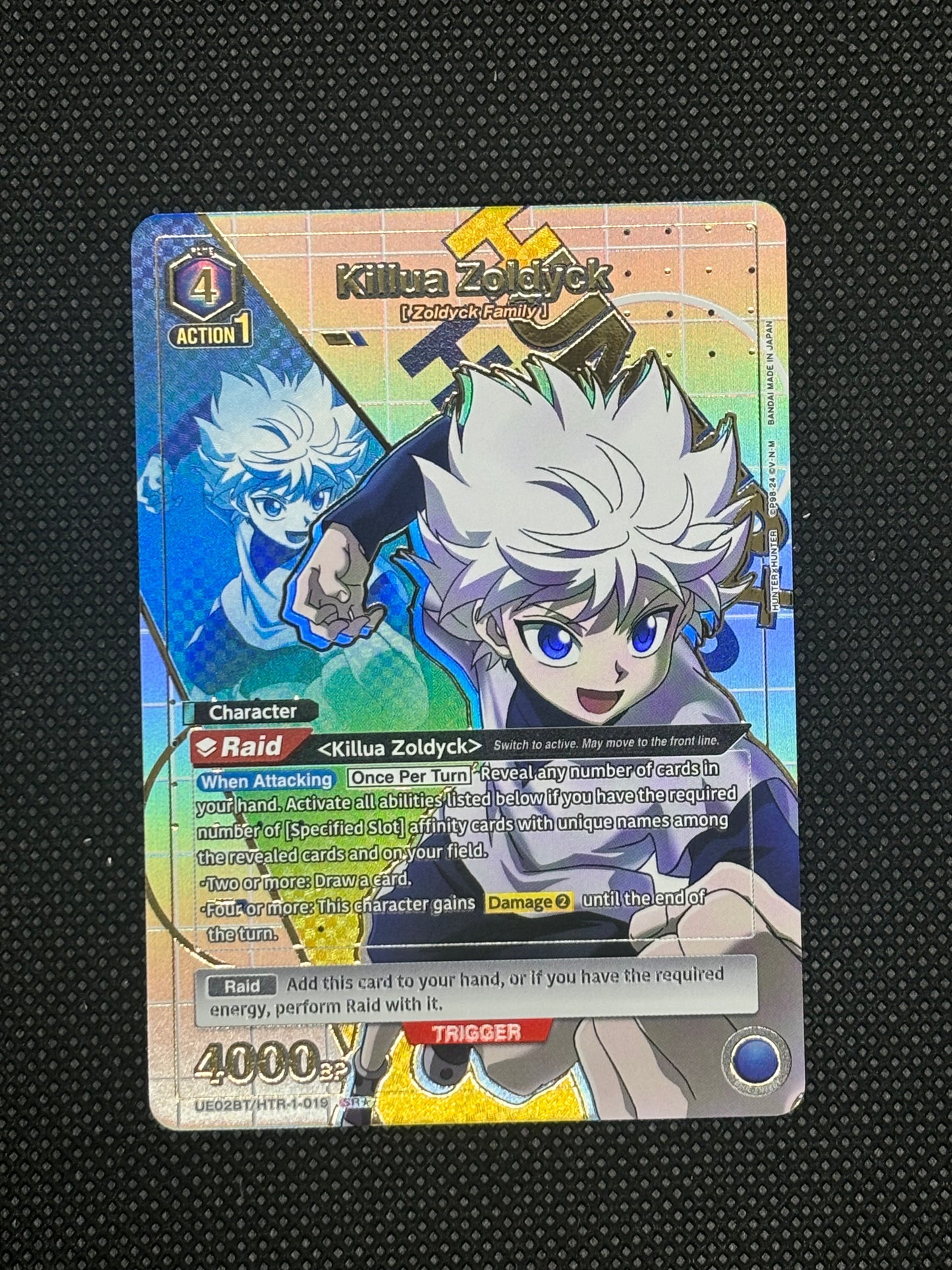 Killua raising fist with a colorful background (Union Arena)