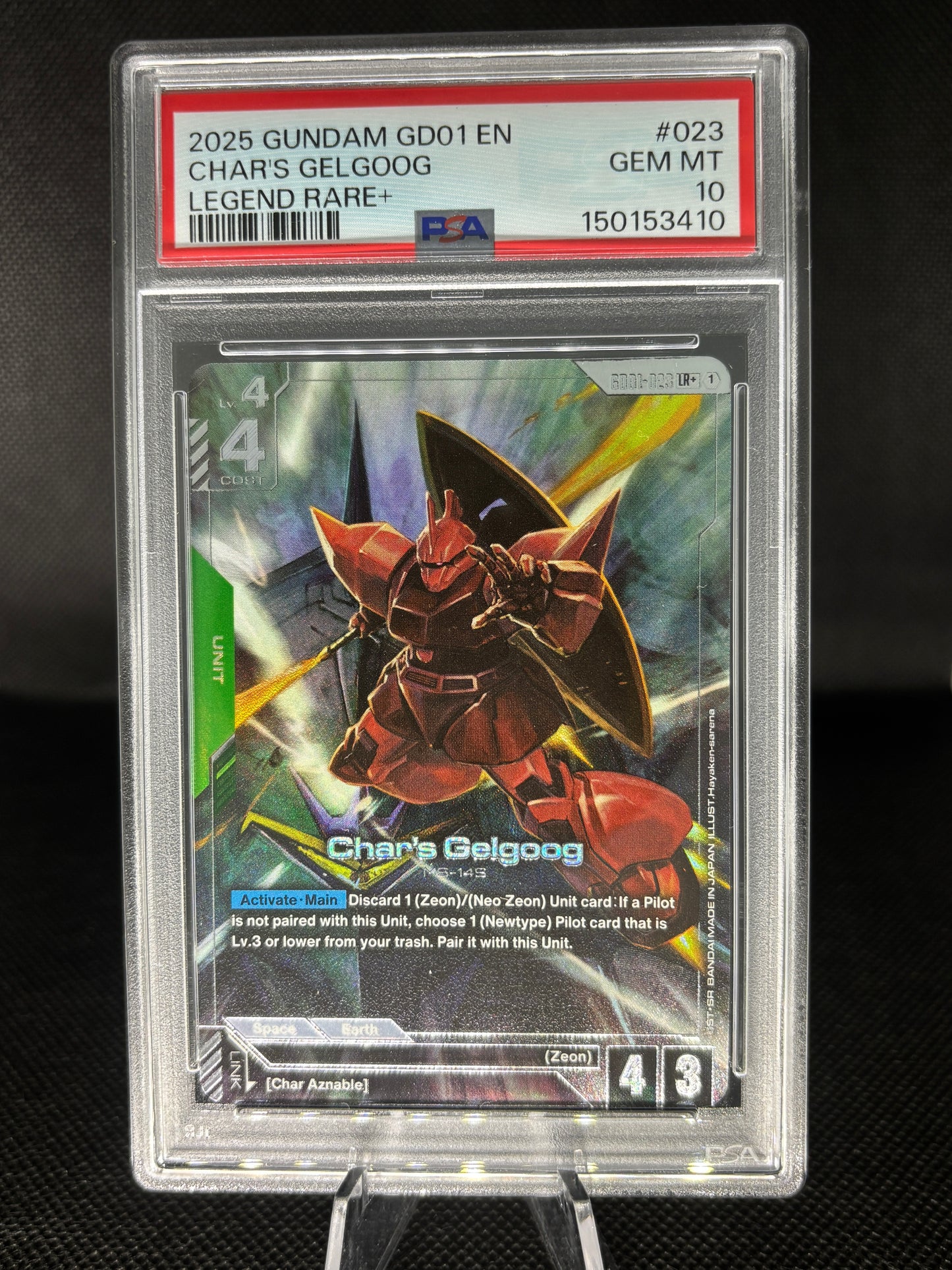 Char's Gelgoog PSA 10 Alternate Art with elmeth behind it