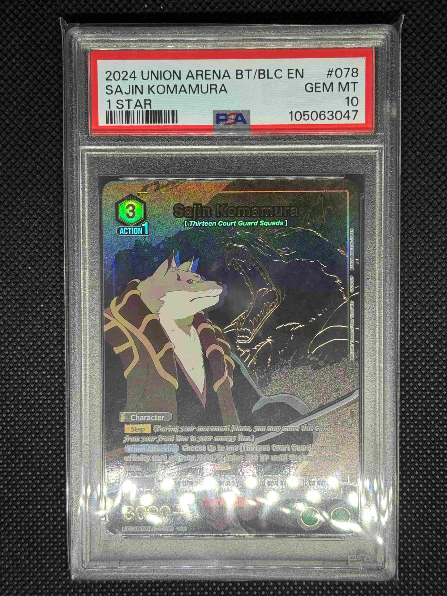 Trading card of Sajin Komamura from Union arena in a protective case with visible grading information on a dark background