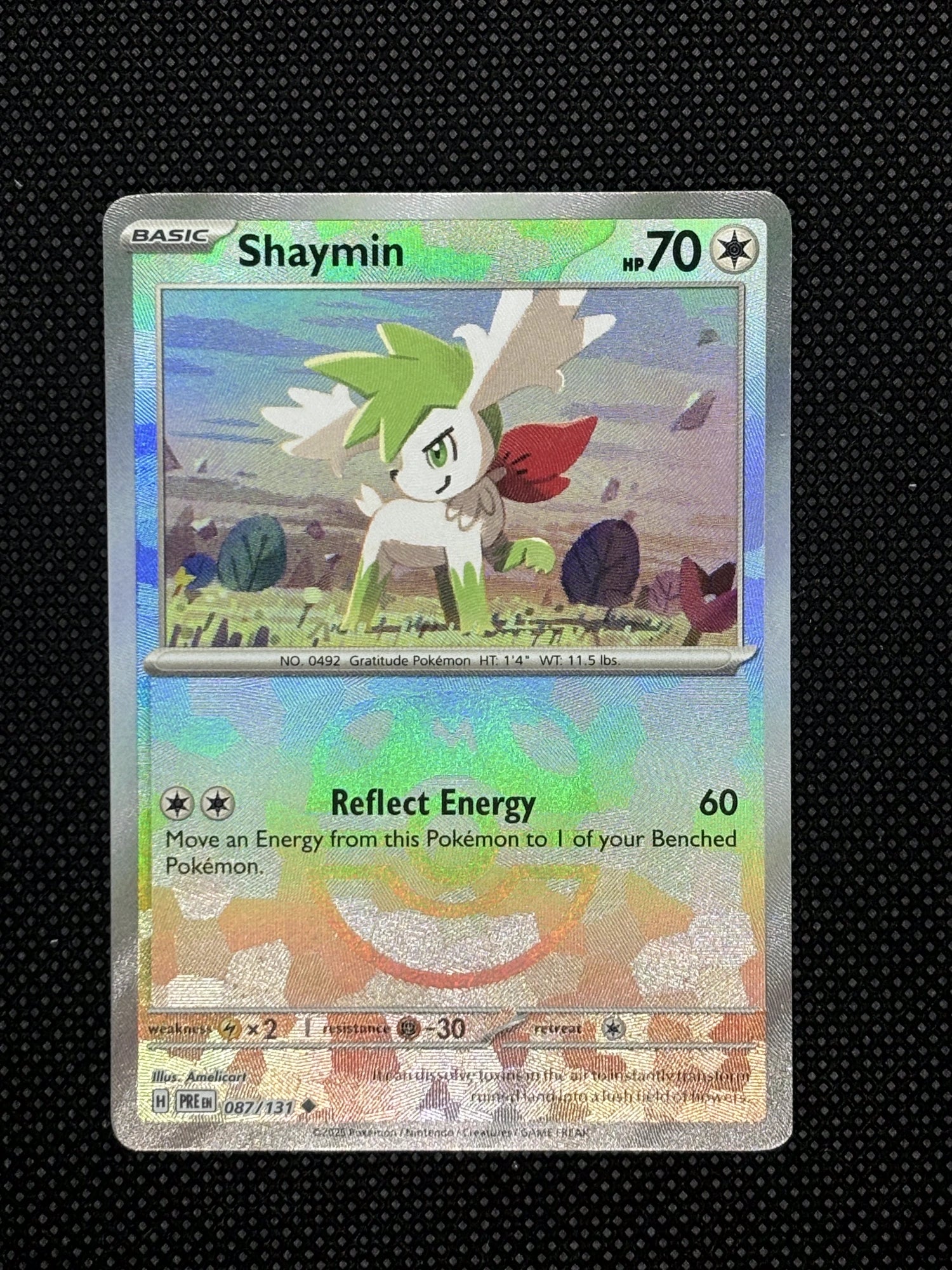 Shaymin Masterball trading card from Prismatic Evolution on top of a black background.