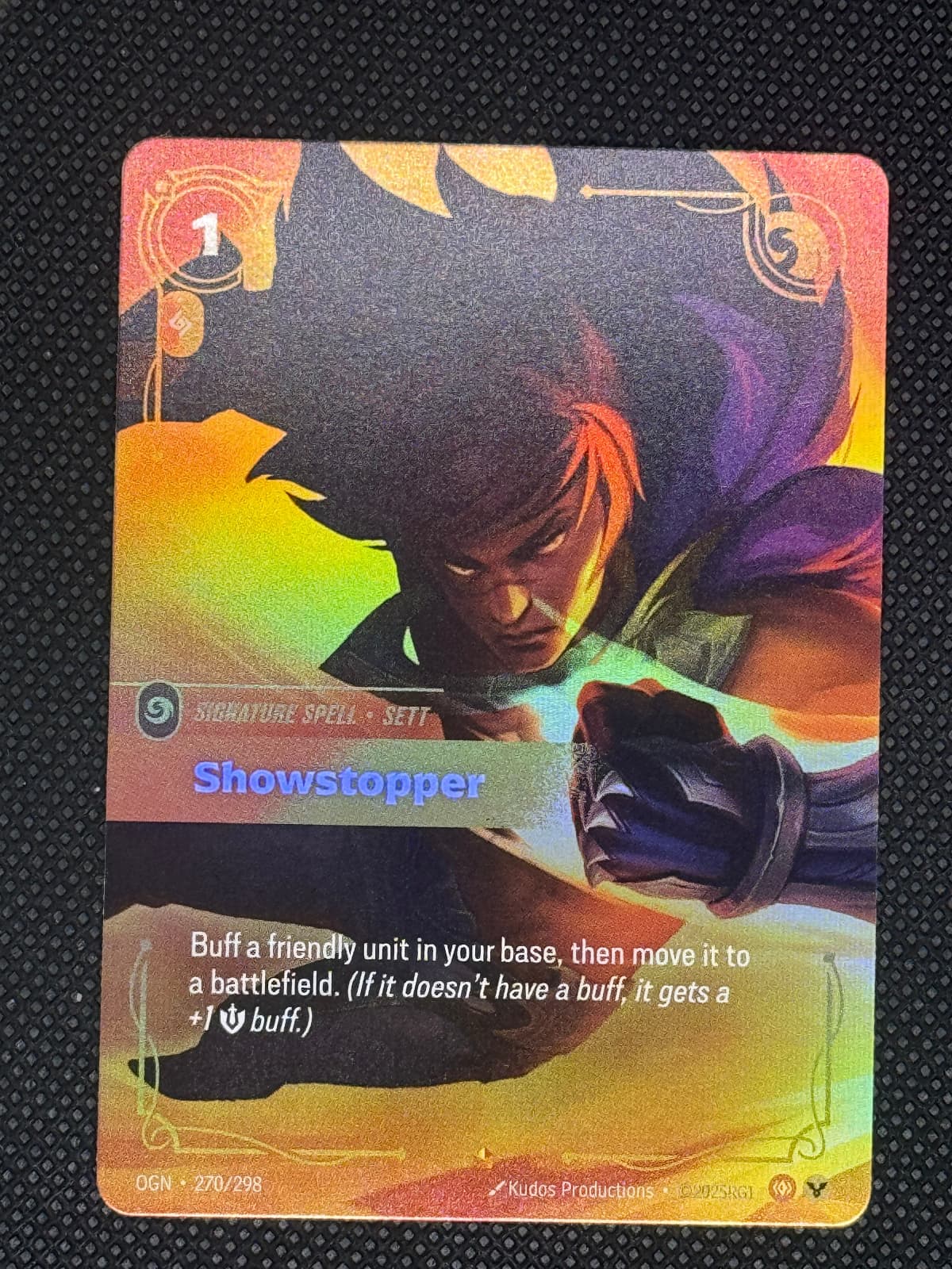 Card with colorful artwork and text on a textured black background