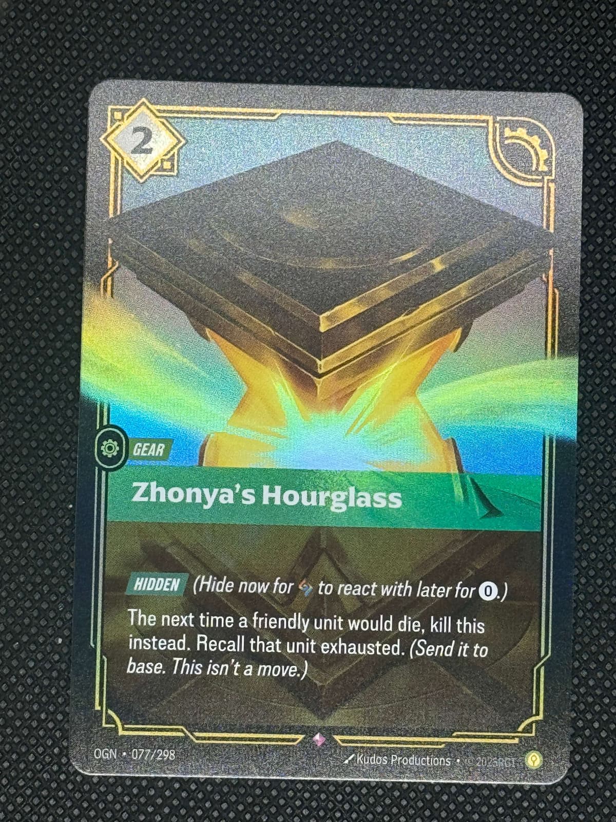 Card featuring 'Zhonya's Hourglass' with colorful design on a textured black background