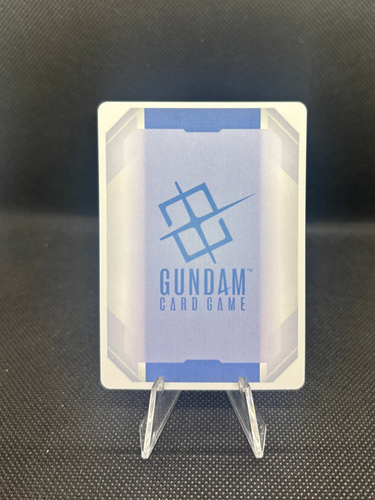 Small electronic component with 'Gundam' branding on a dark textured background