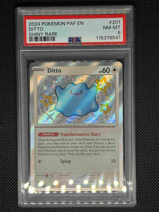 Ditto shiny rare in a PSA 8 that includes, the set, card number, barcode, and ID graded number.