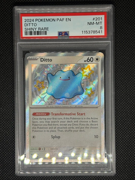 Ditto shiny rare in a PSA 8 that includes, the set, card number, barcode, and ID graded number.