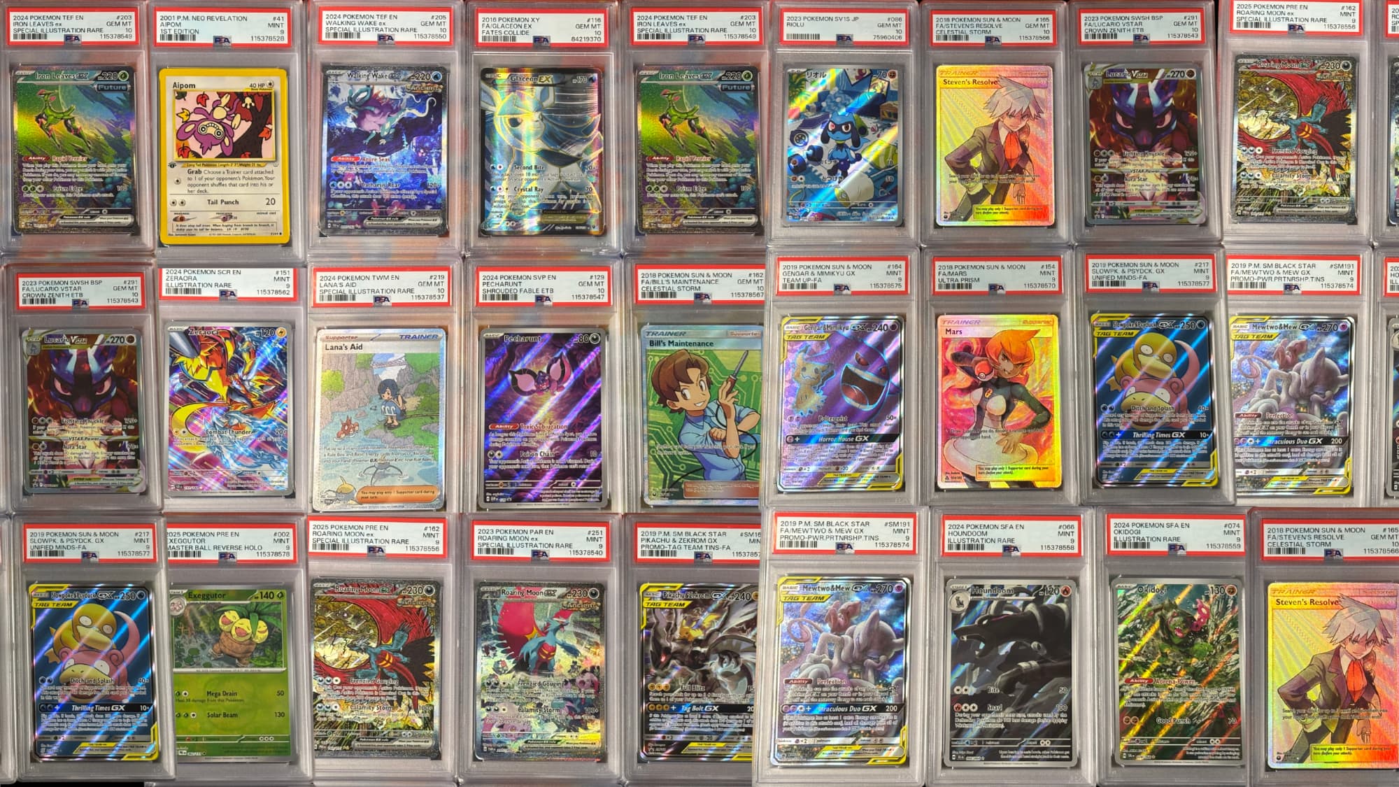 Collection of trading cards in display cases with various card designs.