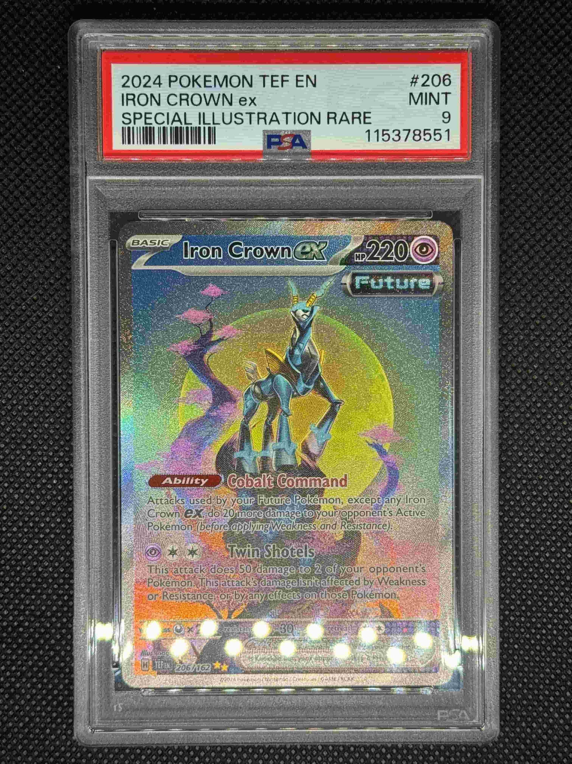 Iron Crown ex SIR in a PSA 9 slab with the set, card number, ID, and barcode.