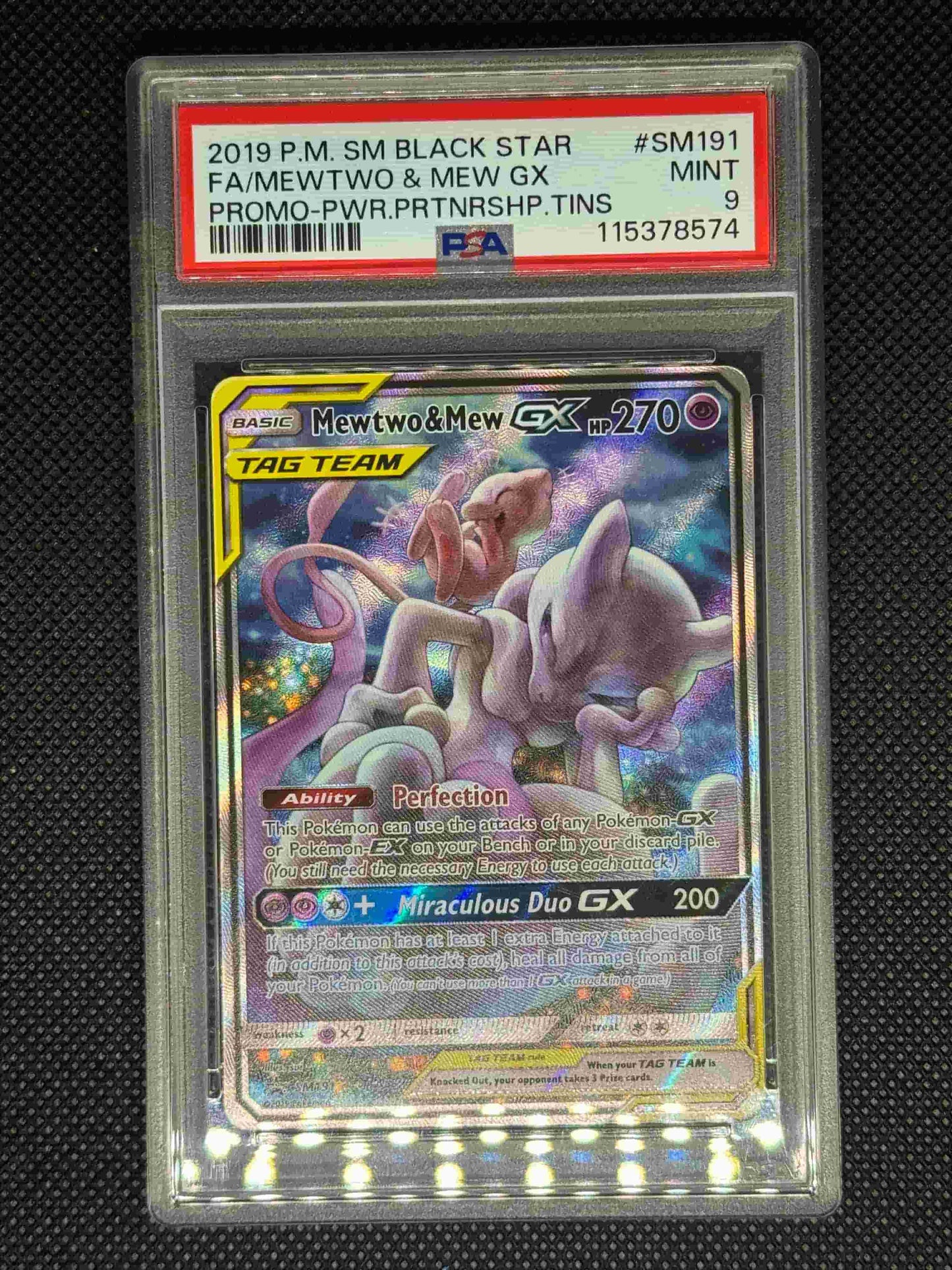 Mewtwo and Mew Gx Promo in a PSA 9 slab with the card number, ID, set, and barcode.