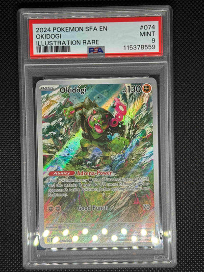 Okidogi illustration rare in a PSA 9 slab with the set, card number, ID, and barcode.
