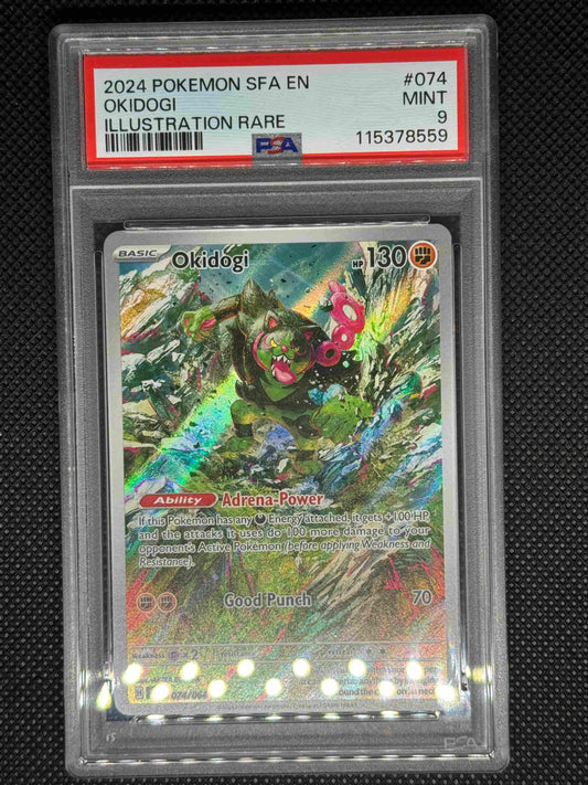 Okidogi illustration rare in a PSA 9 slab with the set, card number, ID, and barcode.