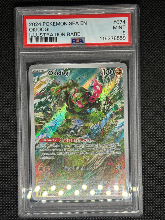 Okidogi illustration rare in a PSA 9 slab with the set, card number, ID, and barcode.