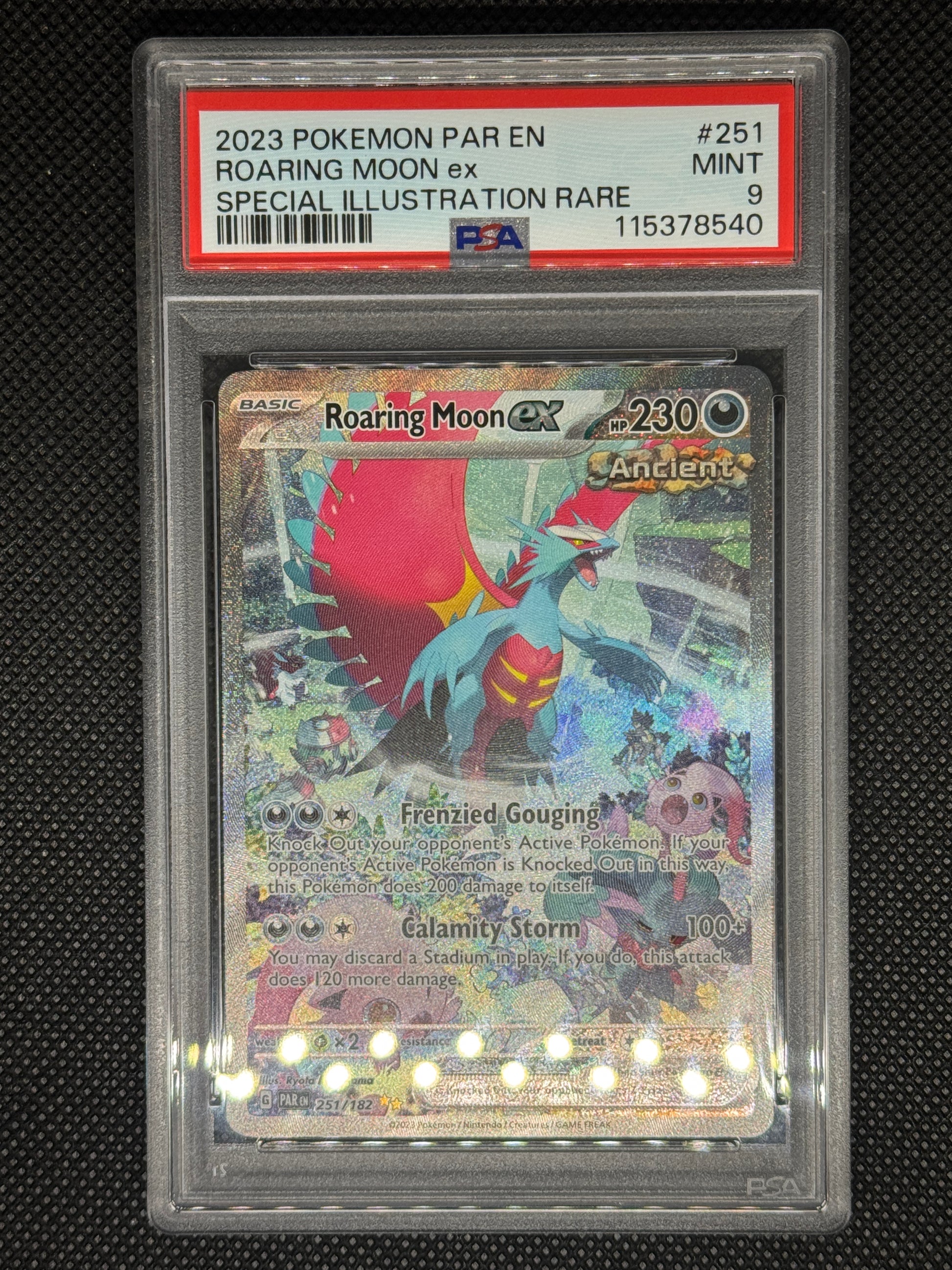 roaringmoonex SIR in a psa9 from paldean fates with ID number, barcode, card number.